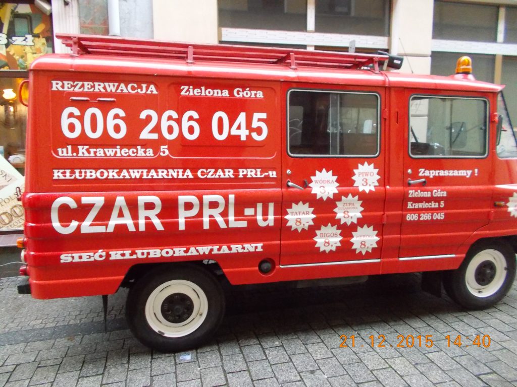 Car painted red with the restaurant's name Czar PRL-u