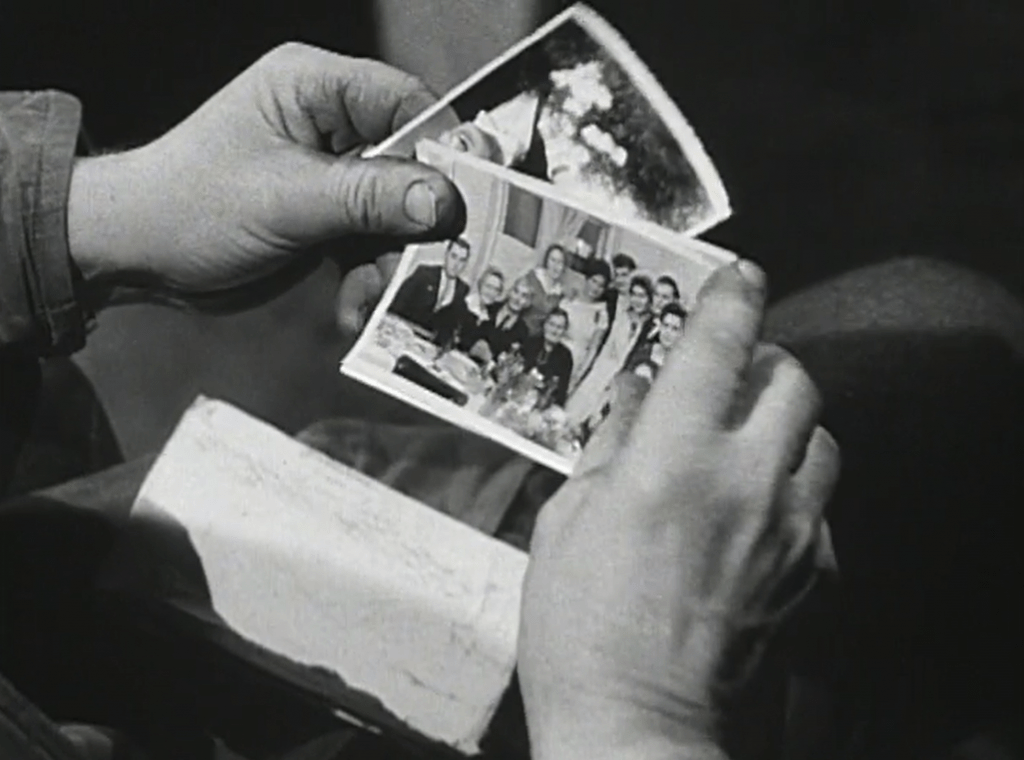 BBC 1960 documentary Borrowed Pasture, Włodzimierz Bułaj is looking at pictures of family last seen twenty years earlier